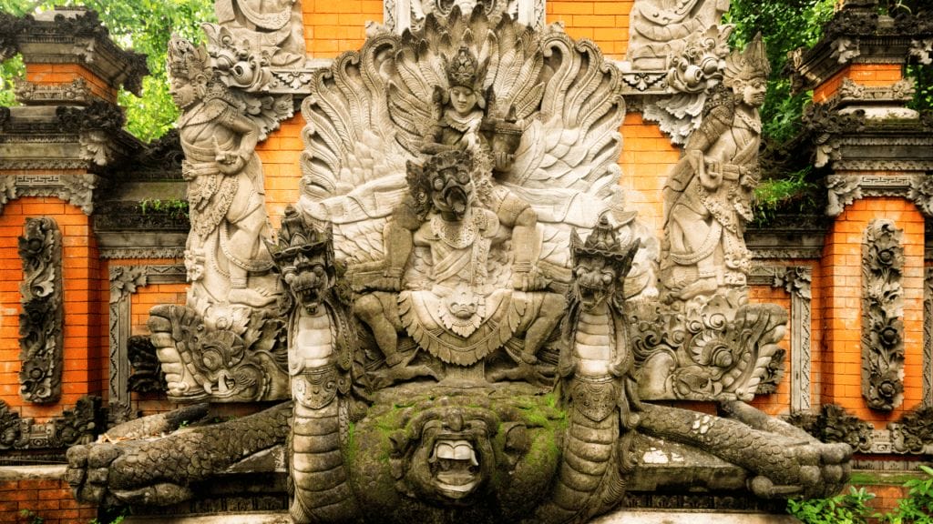 Hindu statue of Vishnu riding Garuda and a glorious turtle