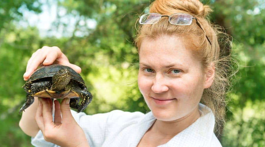 pretty blond women showing her turtle